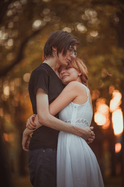 guy and the girl embracing on a background of nature park - Photo, Image
