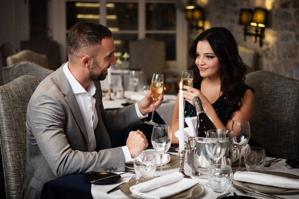 Couple celebrating in restaurant - Photo, Image