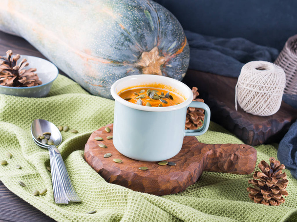 Pumpkin cream soup in mugs for cozy lunch - Photo, Image