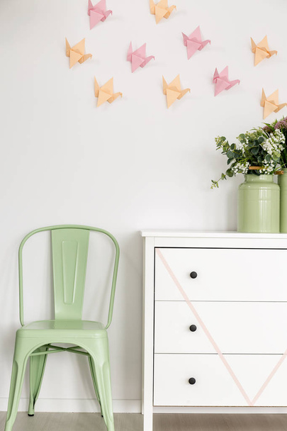 Mint chair and white commode.  - Foto, afbeelding