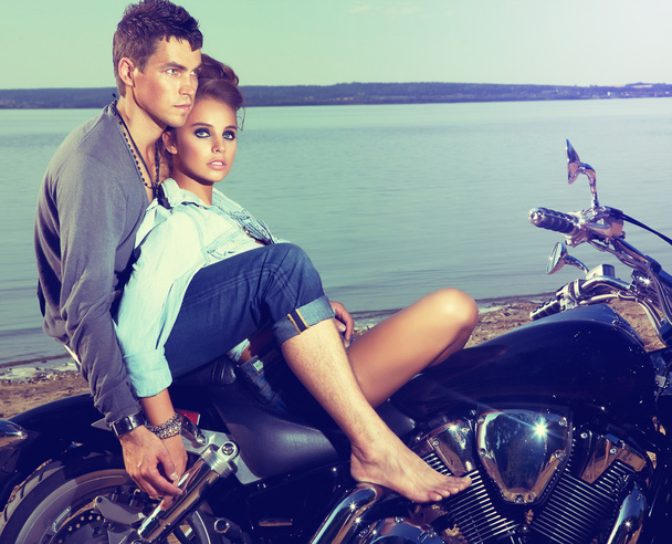 Romantic couple family resting on lake shore - motorbike - Foto, Bild
