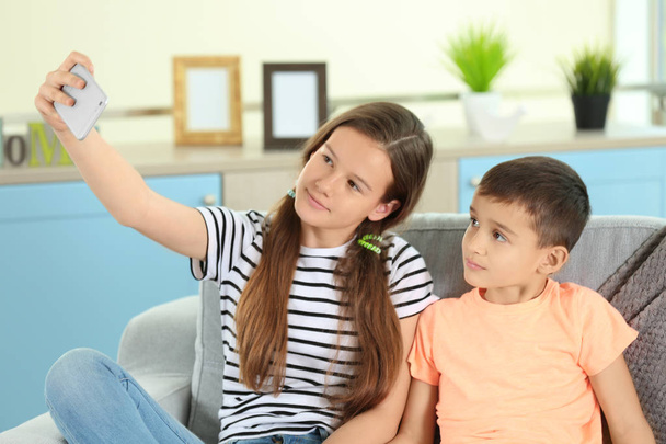 Brother and sister taking selfie - Photo, image