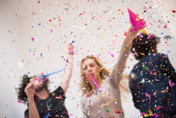 confetti party happy young people - Фото, изображение