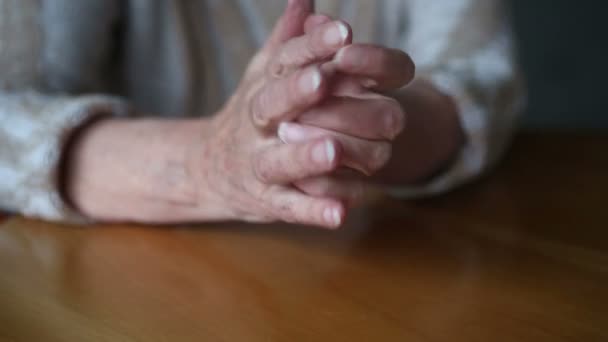 closeup of old womans hands on table moving nervously - Πλάνα, βίντεο