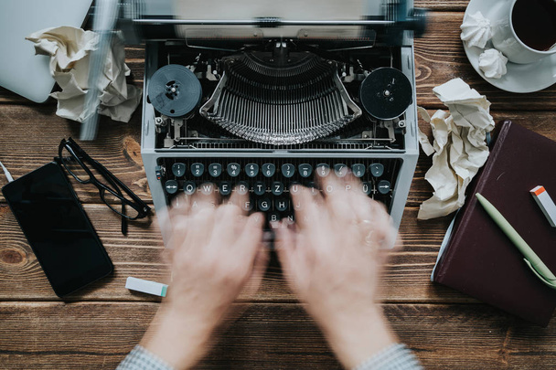 Writer typing with retro writing machine. - Φωτογραφία, εικόνα