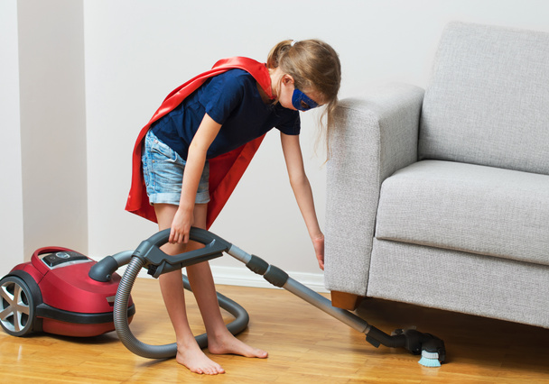 Super hero kid with vacuum cleaner. - Fotoğraf, Görsel