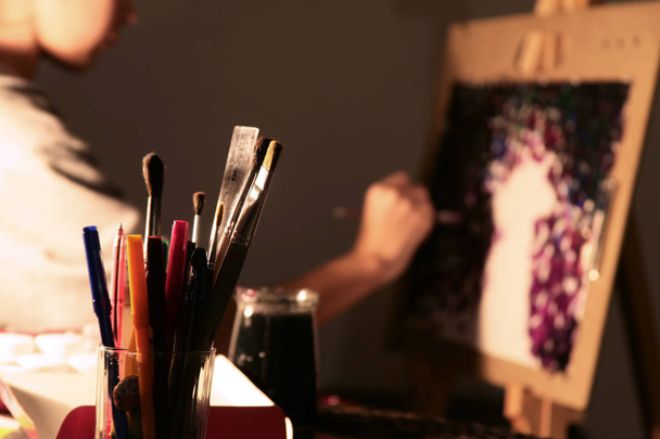 Artistic paintbrushes,and artist painting - Photo, Image