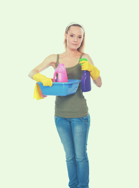 Cheerful woman is cleaning something with wisp and spray attentively. - Photo, Image