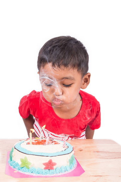 Cute asian little child boy blowing cake on white background  - Φωτογραφία, εικόνα