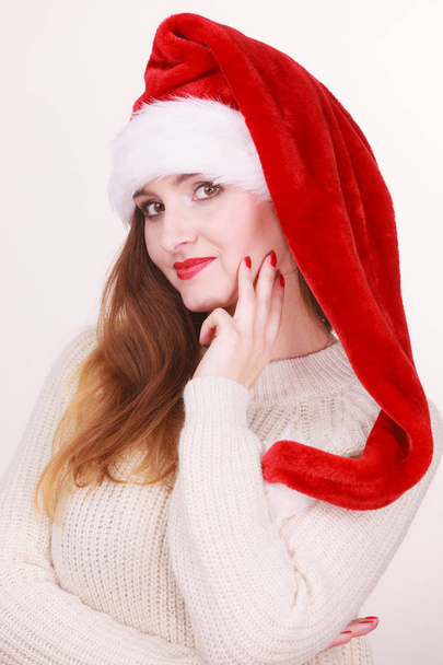 Woman wearing santa claus hat - Foto, Bild