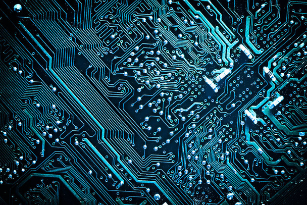 Circuit board. Electronic computer hardware technology. Motherboard digital chip. Tech science background. Integrated communication processor. Information engineering component. Blue color. - Photo, Image