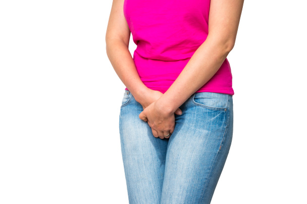 Woman with hands holding her crotch - incontinence concept - Photo, Image