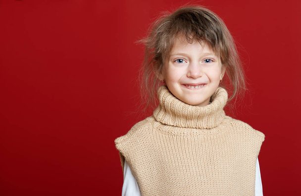 girl child portrait on red, winter holiday concept - Фото, зображення