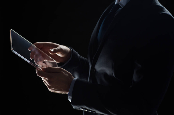 close up of businessman with transparent tablet pc - Foto, imagen