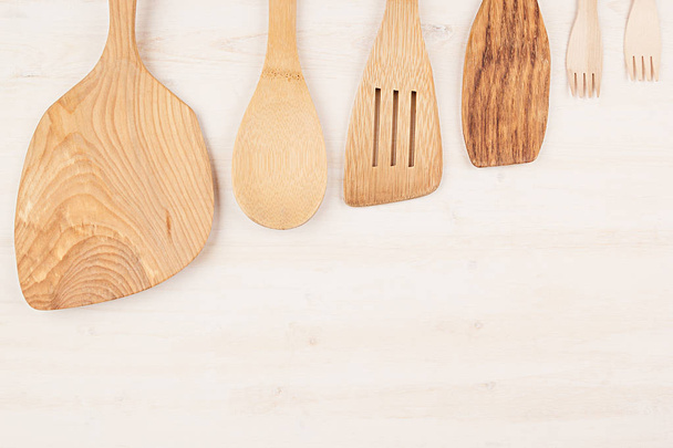 Design concept of mock up of empty wood beige spoons on white wood background.  - Фото, зображення