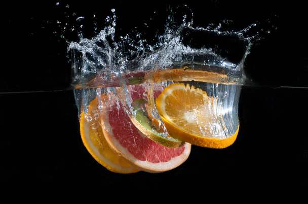Tropical fruits fall underwater - Photo, Image