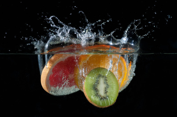 Tropical fruits fall underwater - Fotoğraf, Görsel