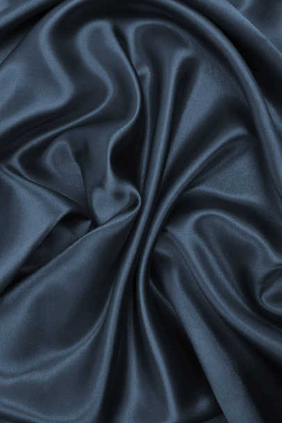 Smooth elegant dark grey silk or satin texture as abstract backg - Photo, Image