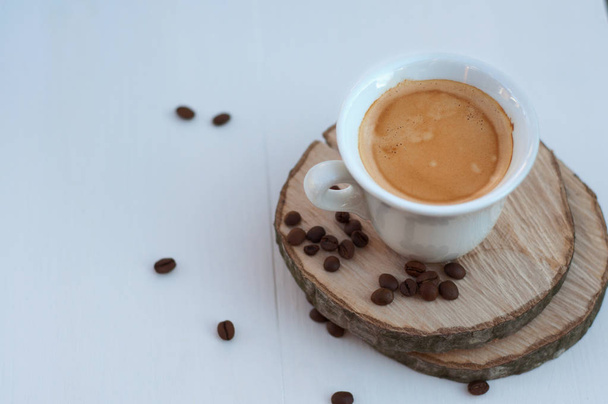 cup of coffee on wooden circles, selective focus - Photo, Image