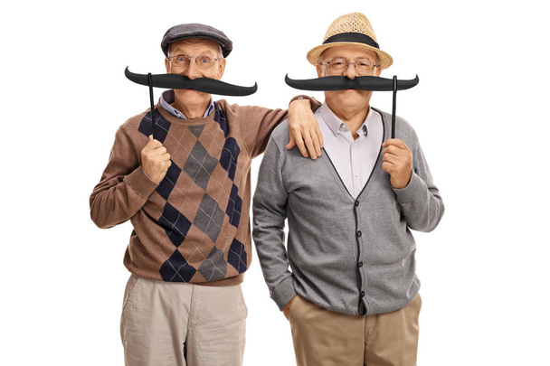Seniors posing with big fake moustaches - Photo, image