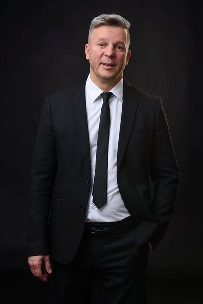 portrait of a confident mature businessman smiling - Fotografie, Obrázek