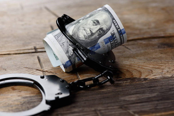 Money in handcuffs. Security concept - Фото, изображение