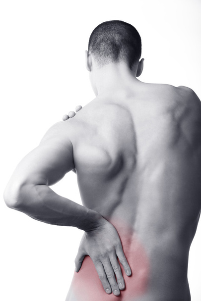 Junger Mann mit Rückenschmerzen im roten Bereich - Foto, Bild
