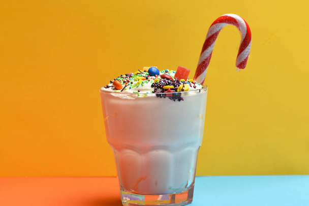 Milk shake with colorful candies - Photo, image
