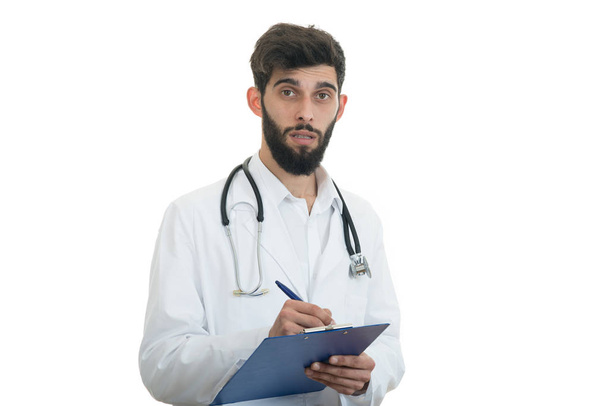 Worried doctor with folder in hands - Фото, изображение