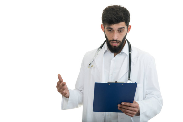 Male Doctor holding folder and stethoscope - Foto, Bild