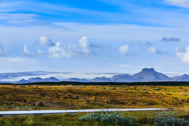 Landscape with highway and icelandic mountain range - Фото, изображение