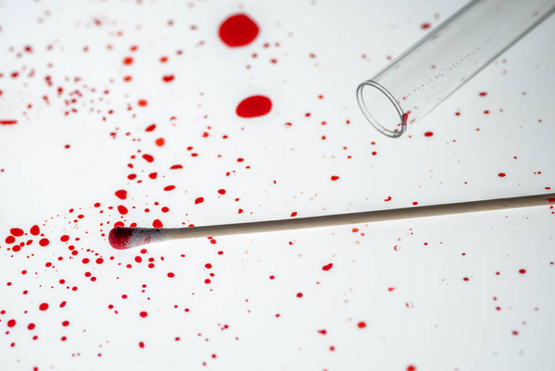 Cotton swab and blood drips in crime scene investigation - Foto, Imagen