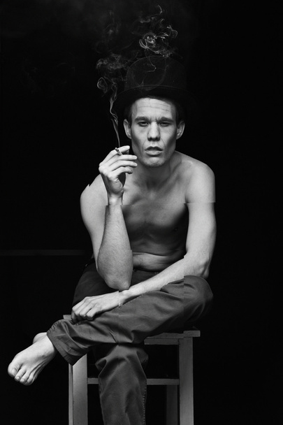 The circus director sitting on a chair and smoking - Photo, Image