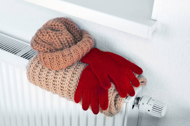 Heating radiator with warm clothes indoor - Фото, изображение