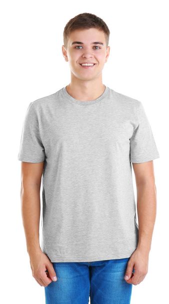 Handsome young man in blank grey t-shirt on white background - 写真・画像