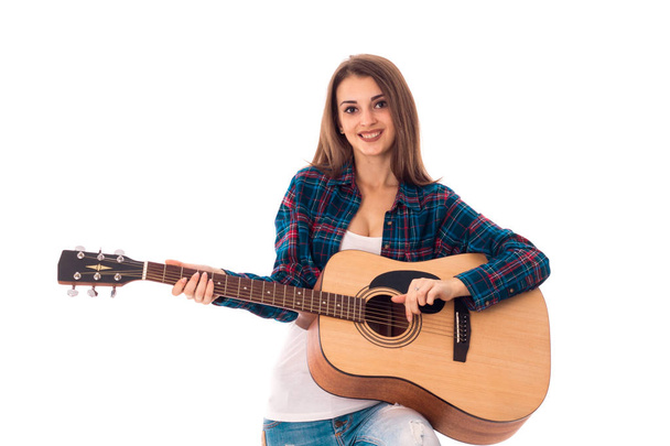 happy young brunette with guitar - Фото, изображение
