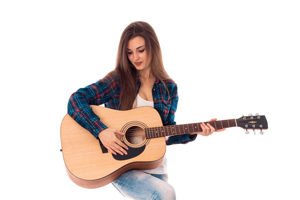 pretty girl with guitar in hands - Foto, afbeelding