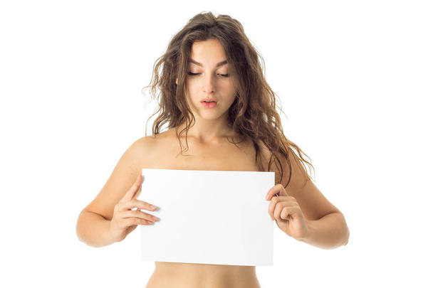 nude brunette girl with placard - Fotó, kép