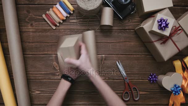 Crop hands cutting paper and wrapping present - Footage, Video