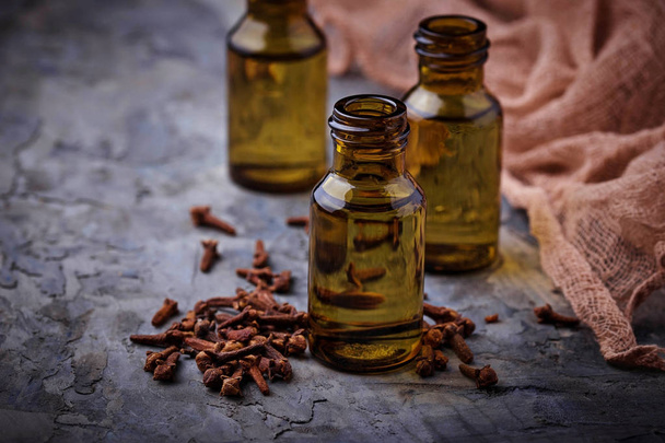 Oil of cloves in a small bottle - Фото, изображение
