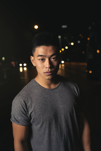 Portrait of a asian young man in the city. - Fotografie, Obrázek