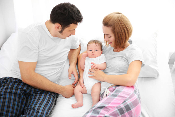 Parents with baby at home - Fotó, kép