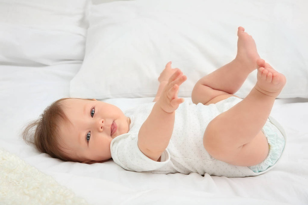 Cute baby lying on bed - Photo, image