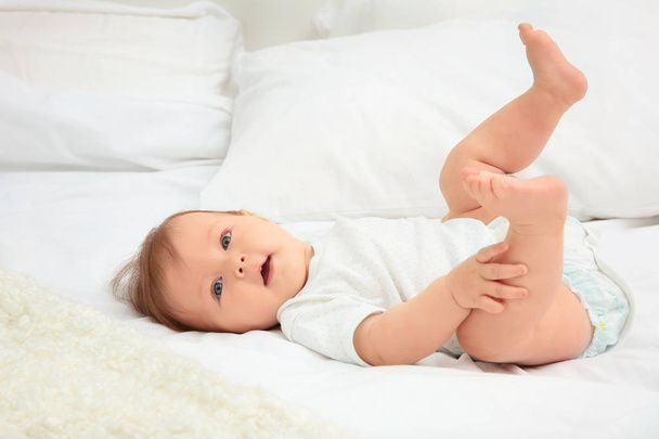 Cute baby lying on bed - Photo, Image