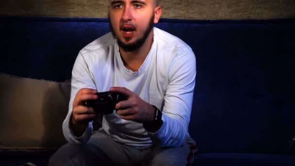 man playing computer games with joystick - Felvétel, videó