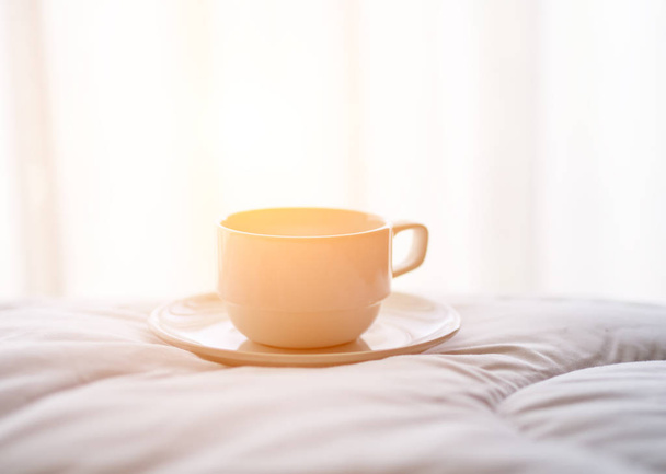 Fresh morning coffee on the bed. - Φωτογραφία, εικόνα