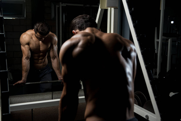 Muscular Man After Exercise Resting In Gym - Φωτογραφία, εικόνα
