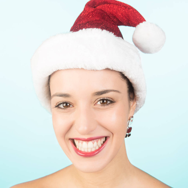 Beautiful and sexy girl wearing santa clause costume on white isolated  - Photo, Image