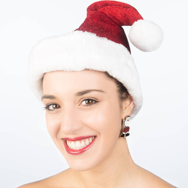 Beautiful and sexy girl wearing santa clause costume on white isolated  - Φωτογραφία, εικόνα