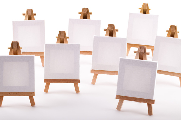 A collection of blank canvases on easels - Photo, Image